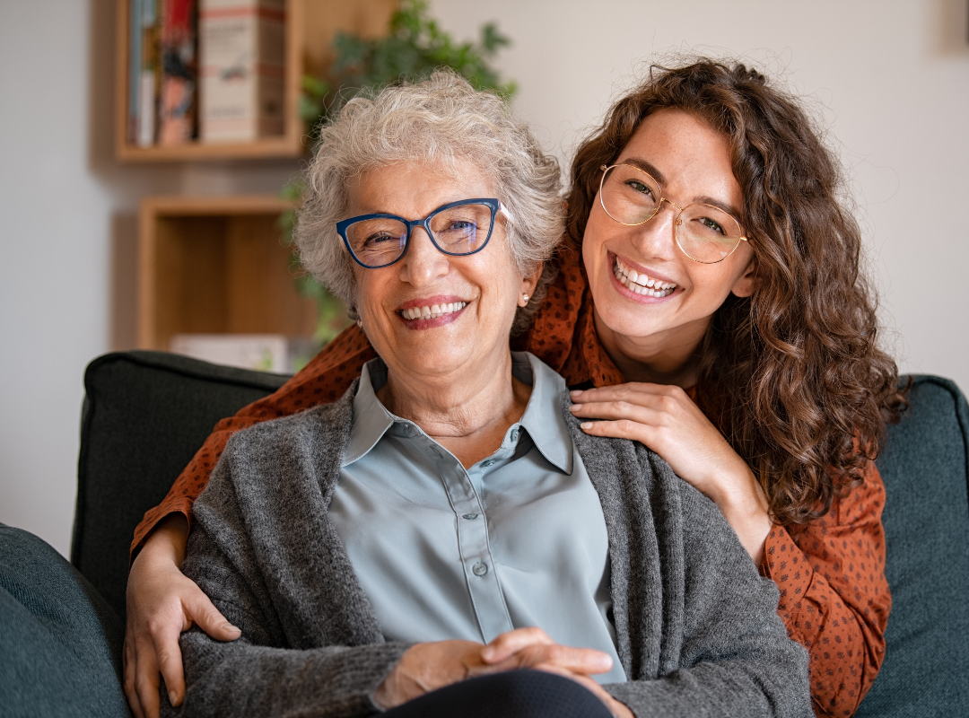 Older mother and daughter laughing